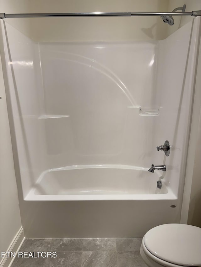 full bathroom with toilet and shower / bathtub combination