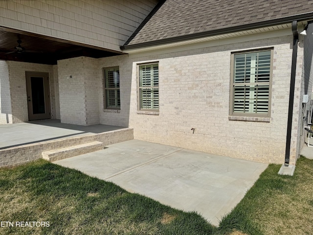 view of patio featuring ceiling fan