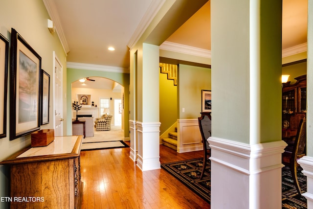 1120 Treymour Way, Knoxville, TN 37922 - hallway featuring ornamental molding, arched walkways, wood-type flooring, wainscoting, and stairs