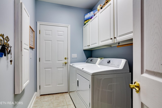 1120 Treymour Way, Knoxville, TN 37922 - washroom with light tile patterned floors, baseboards, cabinet space, and washing machine and dryer