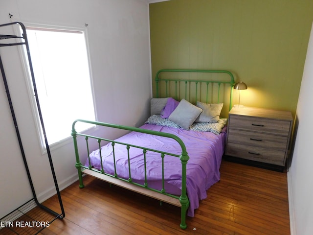 bedroom with hardwood / wood-style flooring