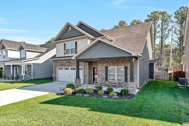 craftsman inspired home with central air condition unit, driveway, fence, a front yard, and a garage