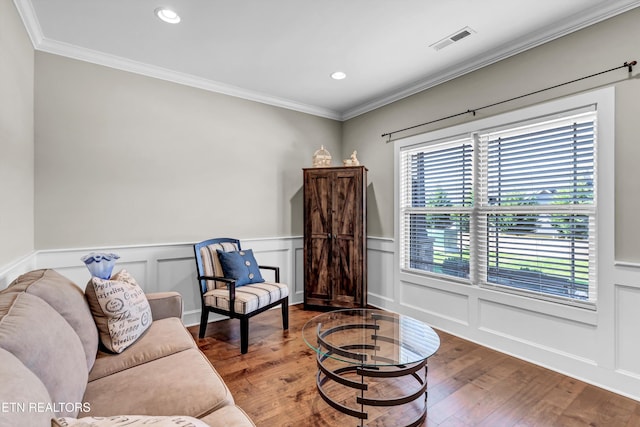 sitting room featuring recessed lighting, wood finished floors, visible vents, and ornamental molding