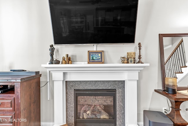 details featuring a glass covered fireplace