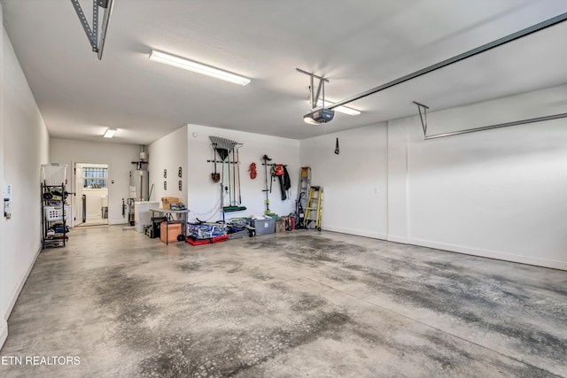 garage featuring gas water heater and a garage door opener