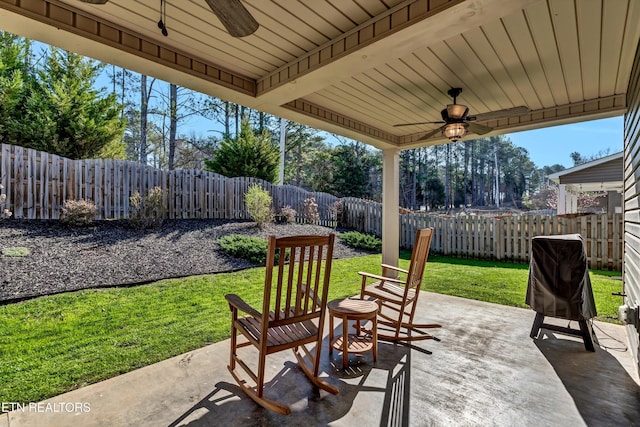 view of patio / terrace with a fenced backyard and ceiling fan