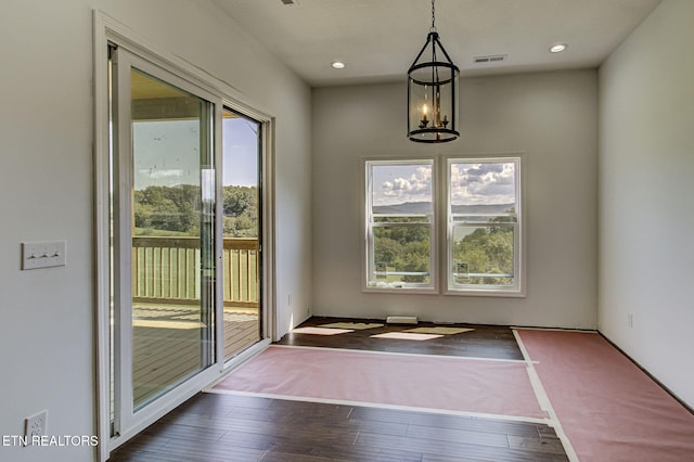 736 Cow Poke Ln, Rutledge, TN 37861 - unfurnished dining area with visible vents, a healthy amount of sunlight, a chandelier, and dark wood-style flooring