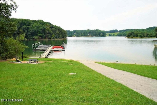 736 Cow Poke Ln, Rutledge, TN 37861 - dock area featuring a yard, a view of trees, and a water view