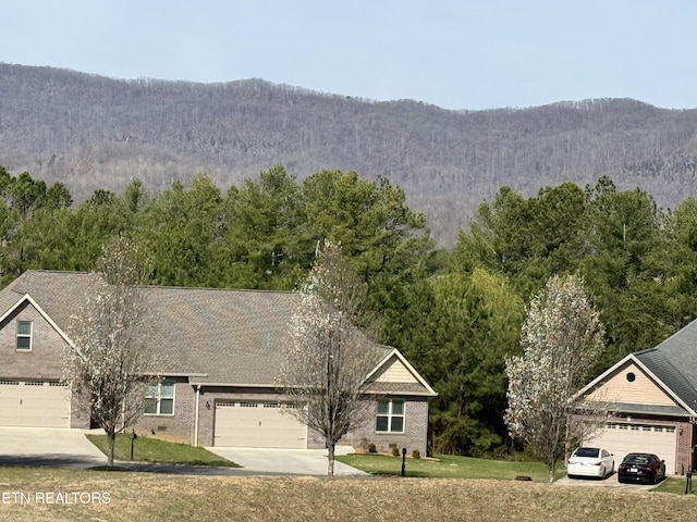 mountain view featuring a view of trees