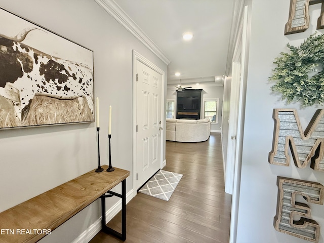 corridor with recessed lighting, crown molding, and wood finished floors
