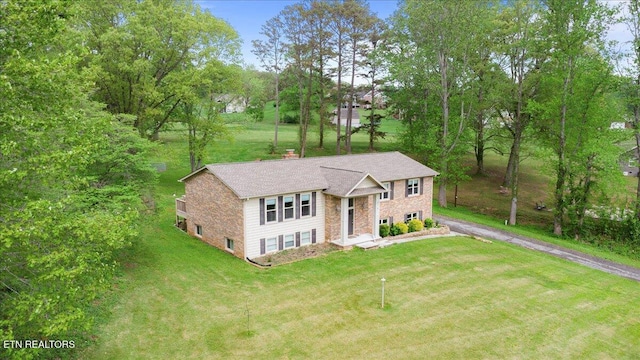 416 Summitt Dr, Lafollette, TN 37766 - view of front of home with a front lawn, a chimney, asphalt driveway, and stone siding