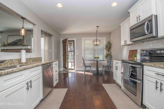 1312 Fox Ridge Dr, Powell, TN 37849 - kitchen featuring decorative backsplash, dark wood finished floors, white cabinetry, and appliances with stainless steel finishes