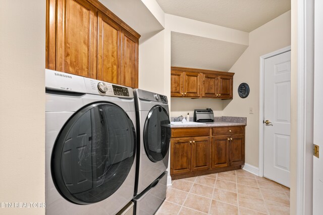 725 Wood Duck Dr, Vonore, TN 37885 - washroom with washer and dryer, cabinet space, light tile patterned flooring, and baseboards