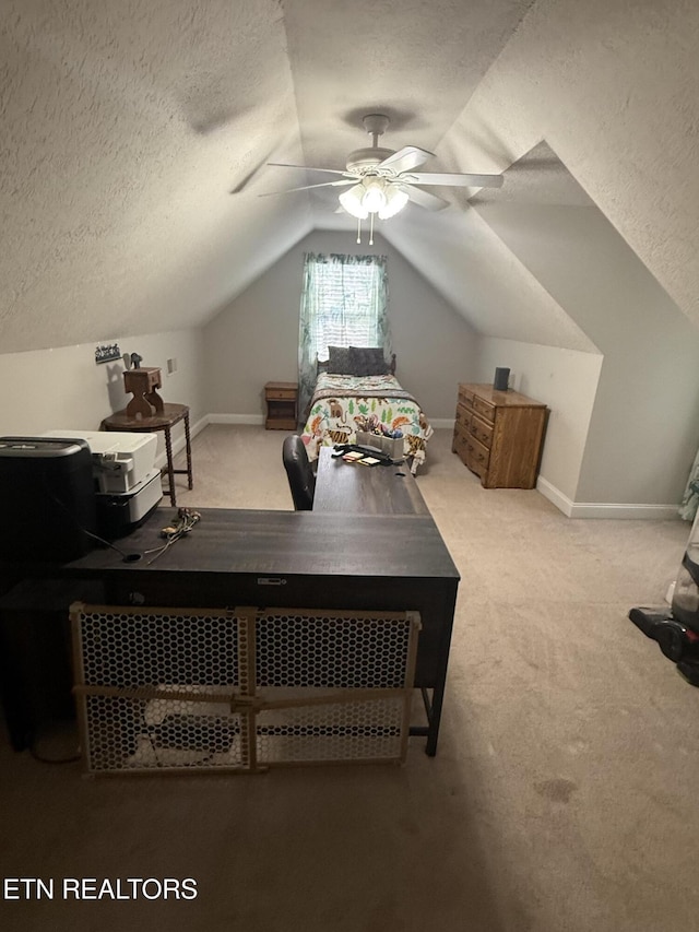carpeted bedroom with baseboards, a textured ceiling, and lofted ceiling