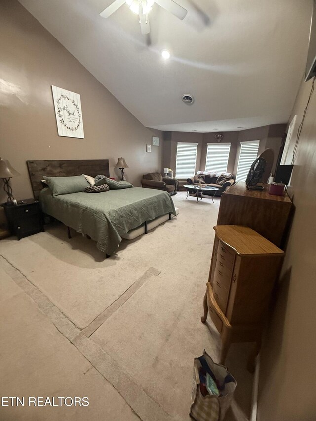 carpeted bedroom with ceiling fan and visible vents