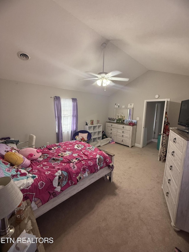 bedroom featuring light colored carpet, ceiling fan, visible vents, and vaulted ceiling