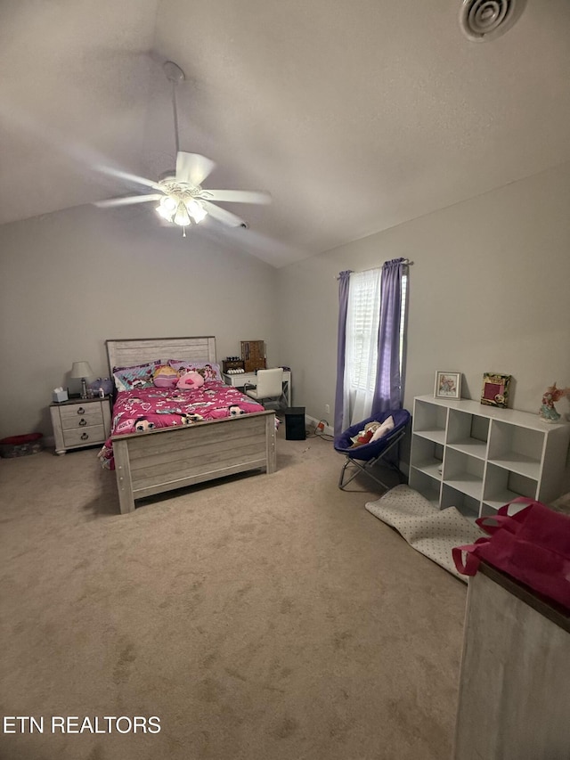 carpeted bedroom featuring a ceiling fan, vaulted ceiling, and visible vents