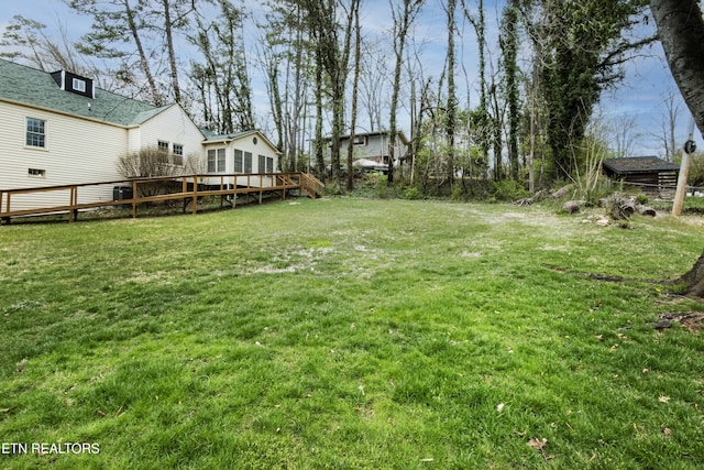 view of yard with a wooden deck