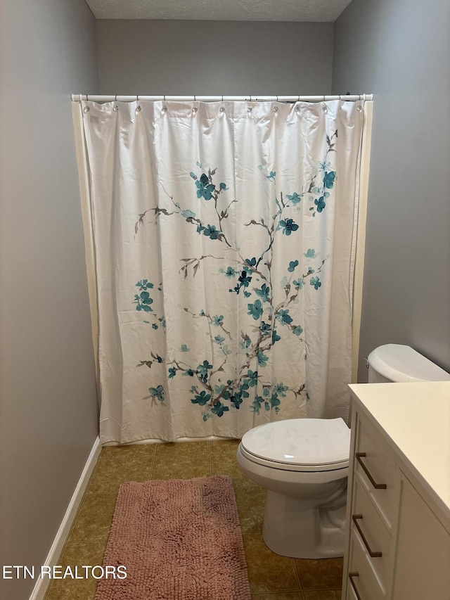219 Burns St, Alcoa, TN 37701 - bathroom featuring vanity, tile patterned flooring, a shower with curtain, and a textured ceiling