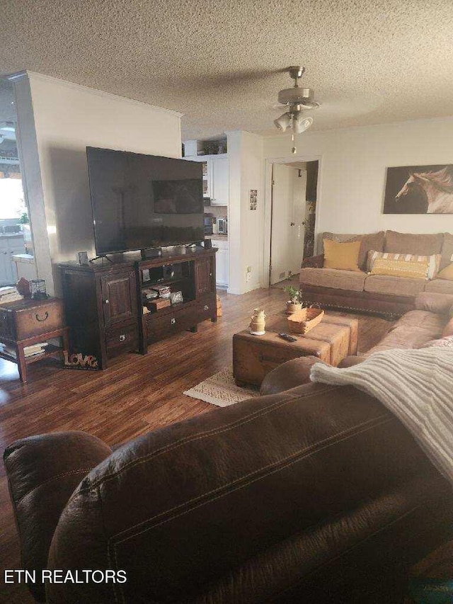 145 Liles Ln, Rocky Top, TN 37769 - living area featuring a textured ceiling, a ceiling fan, and wood finished floors