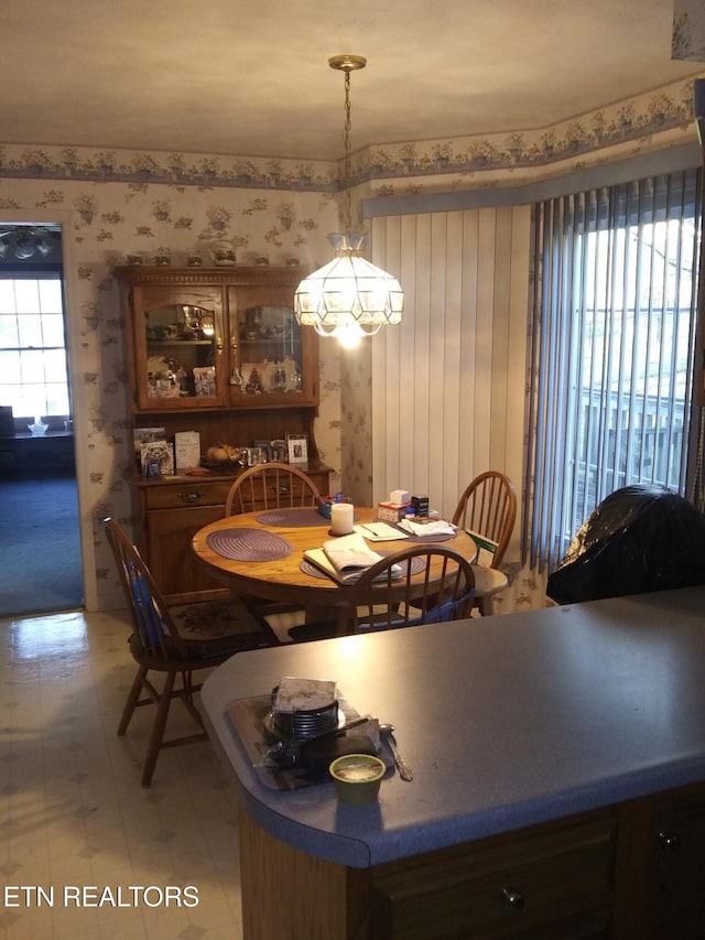 dining room with wallpapered walls