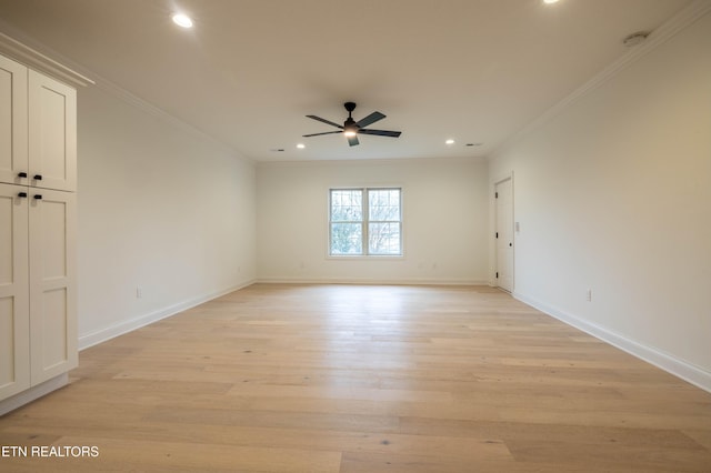 unfurnished room with light wood-style flooring, crown molding, baseboards, and ceiling fan
