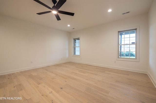 empty room with visible vents, baseboards, ceiling fan, recessed lighting, and light wood-style floors