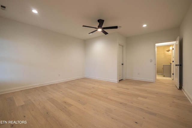 spare room featuring baseboards, recessed lighting, a ceiling fan, and light wood finished floors