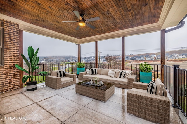 view of patio with an outdoor living space and a ceiling fan
