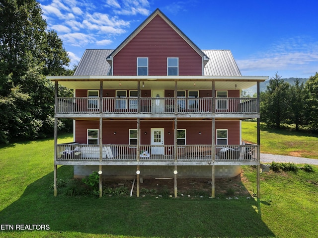 2560 Schisandra Ln Lane, Cosby, TN 37722 - rear view of house featuring a metal roof and a lawn