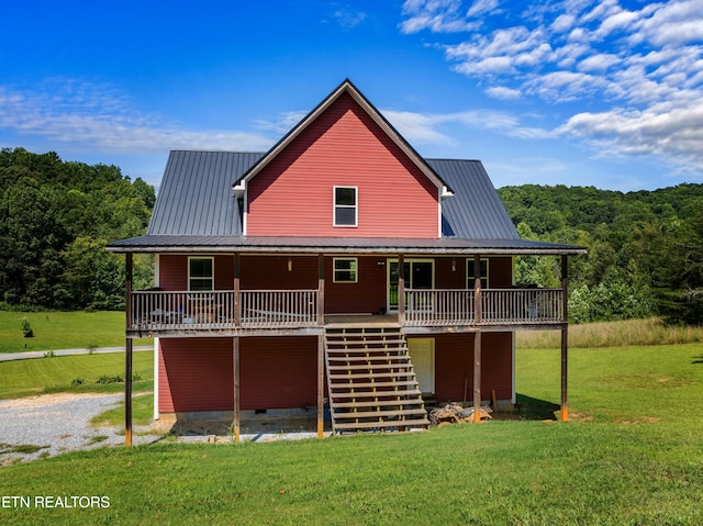 2560 Schisandra Ln Lane, Cosby, TN 37722 - back of house with a lawn, a metal roof, a wooded view, and stairs
