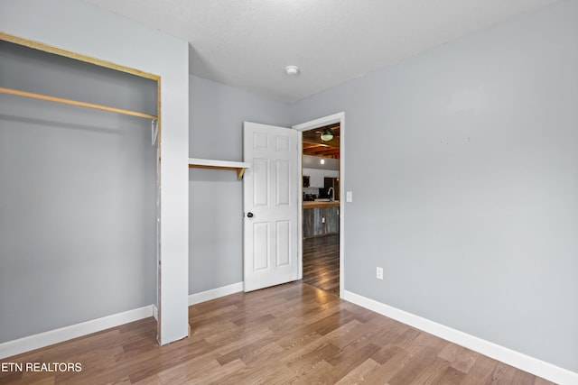 2560 Schisandra Ln Lane, Cosby, TN 37722 - unfurnished bedroom with wood finished floors and a closet