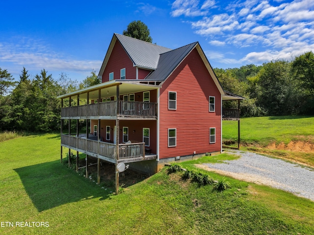 2560 Schisandra Ln Lane, Cosby, TN 37722 - back of house with a lawn, driveway, a metal roof, and covered porch