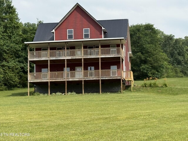2560 Schisandra Ln Lane, Cosby, TN 37722 - rear view of house featuring a yard and a metal roof