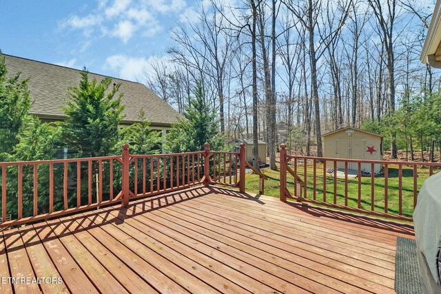 deck featuring a storage unit and an outdoor structure