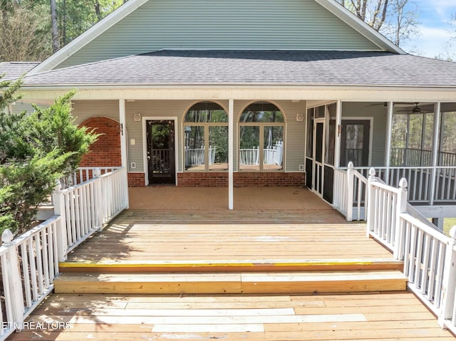 deck with a sunroom