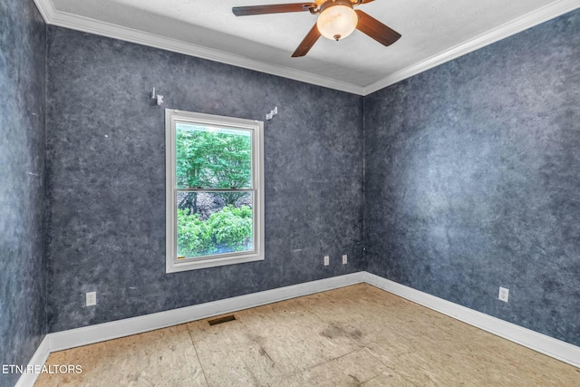 empty room with ceiling fan, baseboards, ornamental molding, and visible vents