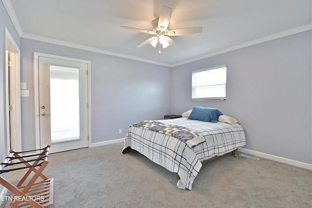 bedroom with crown molding, baseboards, and carpet floors