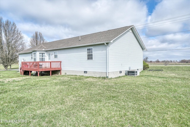 back of house featuring a yard, cooling unit, a wooden deck, and a shingled roof