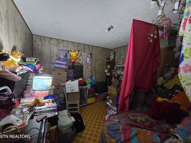 bedroom featuring wood walls