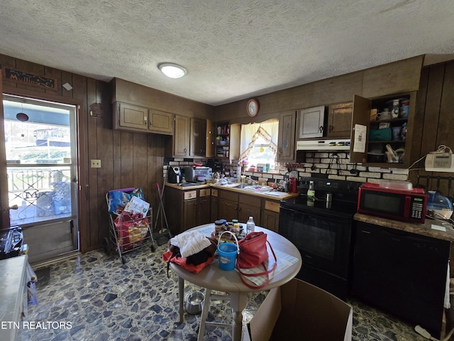 kitchen with black range with electric stovetop, a textured ceiling, wooden walls, exhaust hood, and dishwashing machine