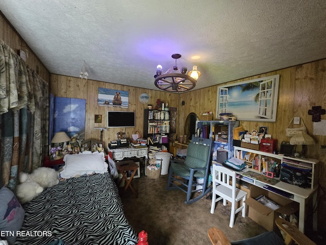 1849 Old Harlan Rd, Jonesville, VA 24263 - bedroom with carpet floors, wood walls, a textured ceiling, and a chandelier