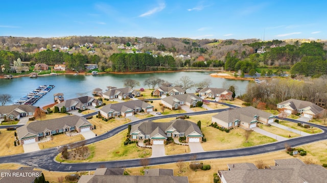 bird's eye view featuring a residential view and a water view