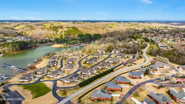 aerial view with a residential view and a water view