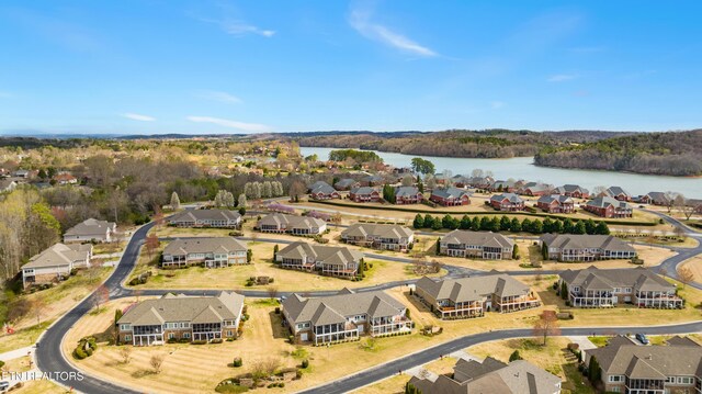 drone / aerial view with a residential view and a water view