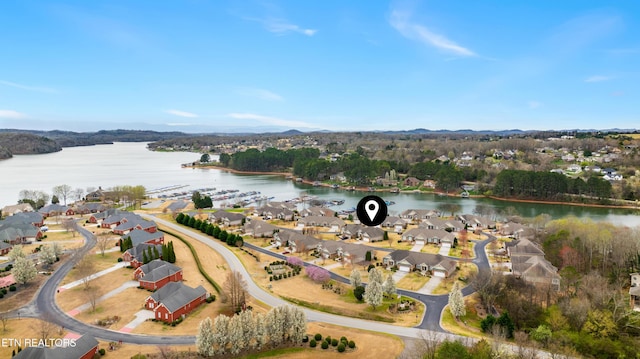birds eye view of property with a residential view and a water view