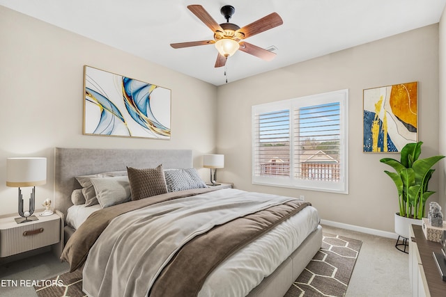 carpeted bedroom featuring baseboards, visible vents, and a ceiling fan