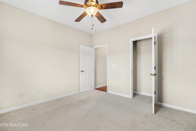 unfurnished bedroom with carpet floors, baseboards, and ceiling fan