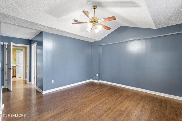 221 Woodland Rd Unit 315, Gatlinburg, TN 37738 - spare room with baseboards, a textured ceiling, a ceiling fan, lofted ceiling, and wood finished floors