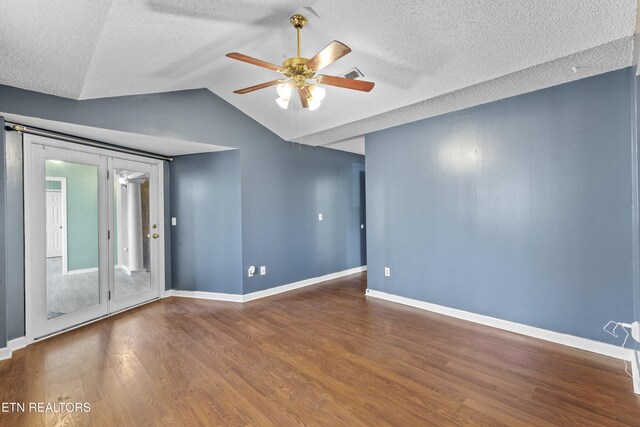 221 Woodland Rd Unit 315, Gatlinburg, TN 37738 - empty room featuring baseboards, ceiling fan, a textured ceiling, vaulted ceiling, and wood finished floors